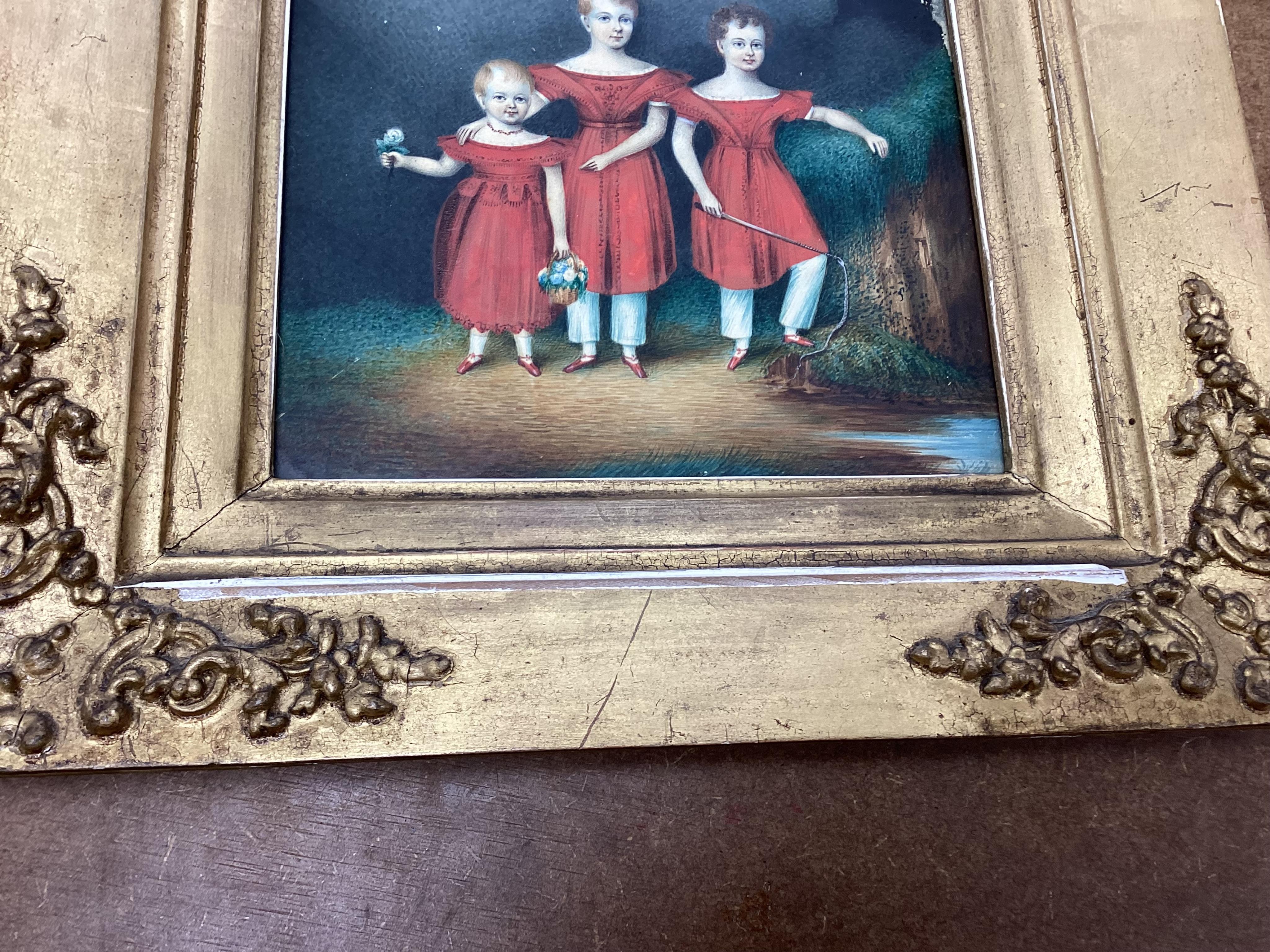 Regency School, Portrait of three siblings beside a river, unsigned, watercolour on card, 20 x 17cm, ornate gilt frame